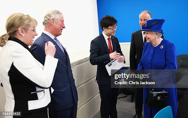 Of the Prince's Trust Martina Milburn laughs with Queen Elizabeth II and Prince Charles, Prince of Wales at the Prince's Trust Centre in Kennington...