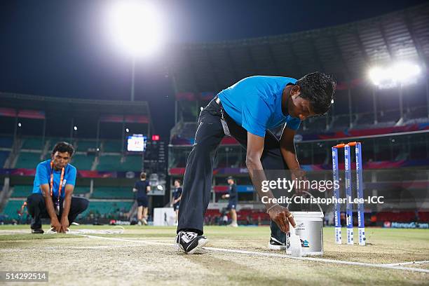 The groundsmen prepere the pitch during the ICC Twenty20 World Cup Group B match between Scotland and Afghanistan at the Vidarbha Cricket Association...