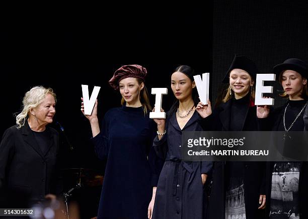 French fashion designer Agnès Troublé acknowledges the audience following the Agnes B during the 2016-2017 fall/winter ready-to-wear collection on...