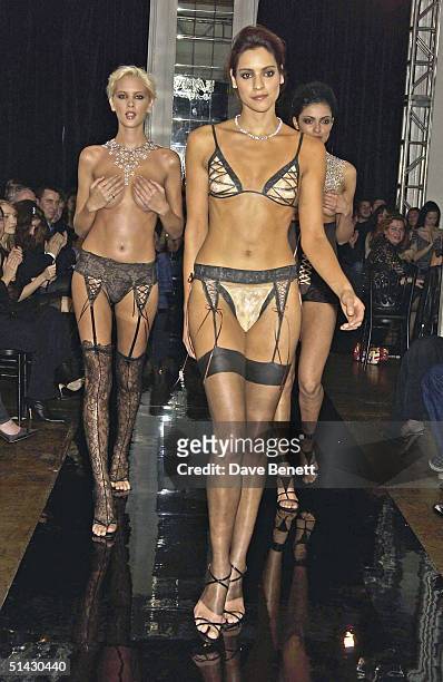 Models perform on the catwalk for The La Perla Lingerie and De Beers Charity Fashion Show in aid of Cancer Research UK on February 4, 2004 in London.