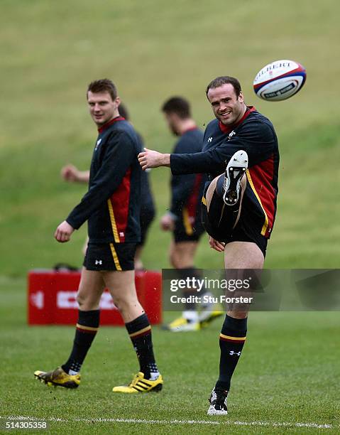 Wales player Dan Biggar looks on as Jamie Roberts kicks the ball during training ahead of their RBS Six Nations match against England, at The Vale...