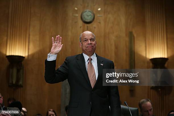 Secretary of Homeland Security Jeh Johnson is sworn in during a hearing before the Senate Homeland Security and Governmental Affairs Committee March...