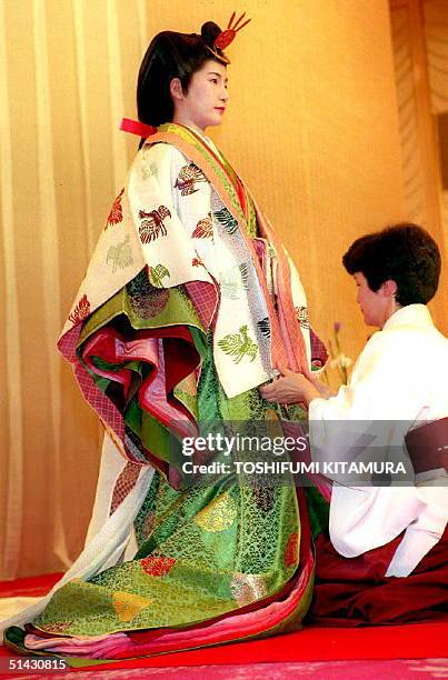 Yuriko Takamori wears the 12-layer traditional formal Japanese royal dress worth 10 million yen and weighing 18 kilograms 05 May 1993 during an...