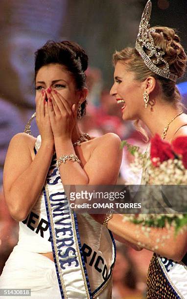 Miss Universe 1993 winner, Dayanara Torres of Puerto Rico reacts after winning the beauty pageant. At her side is Miss Universe 1992, Michelle McLean.