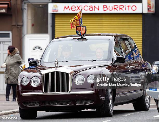 Queen Elizabeth II and Prince Charles, Prince of Wales arrive in The Queen's Bentley car as they visit The Prince's Trust Centre in Kennington to...