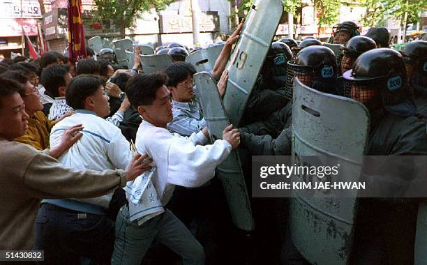 South Korean students battle riot police during a demonstration commemorating the 1980 civilian uprising in Kwangju, in front of Seoul's Kanghee...