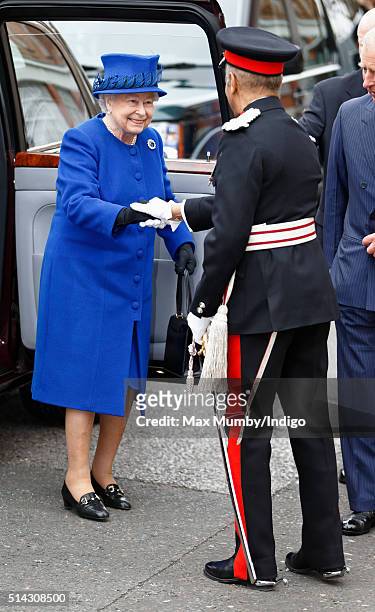 Queen Elizabeth II is greeted by The Lord-Lieutenant of Greater London, Kenneth Olisa as she visits The Prince's Trust Centre in Kennington to mark...