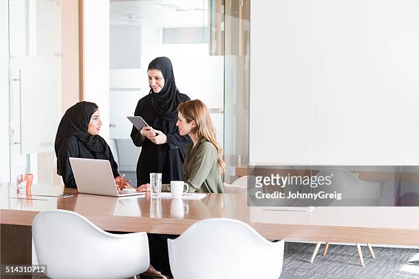 women in business meeting in middle east office - förenade arabemiraten bildbanksfoton och bilder
