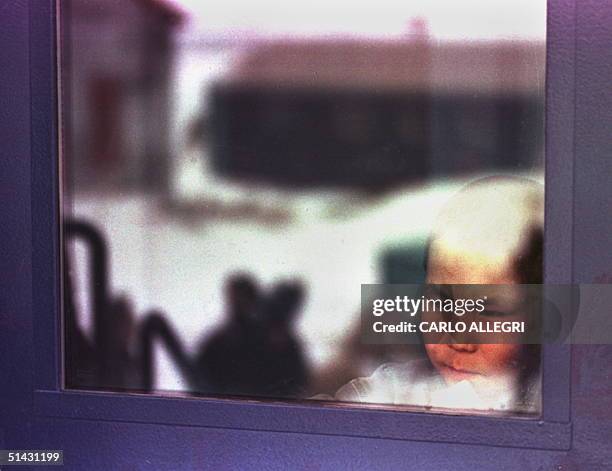 Window Inuit An Inuit child looks out a window in Iqaluit, North West Territories ...