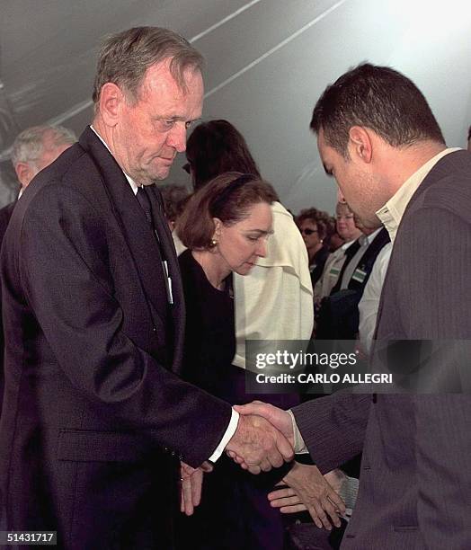 Canadian Prime Minister Jean Chretien and his wife Aline shakes hands with family members of victims of Swissair crash 111 after a memorial service...