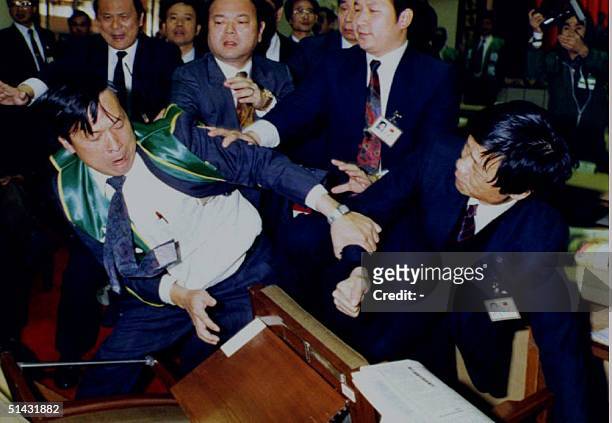 Opposition Democratic Progressive Party deputy Chen Ching-lung is surrounded by ruling Koumintang deputies in what was considered the most serious...