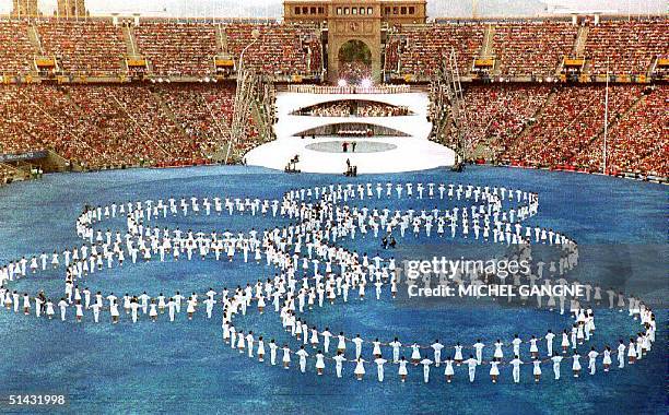 The Olympic rings are set on the pitch during the opening ceremony of the XXVth Summer Olympics 25 July 1992 at Montjuic Stadium. Approximately...