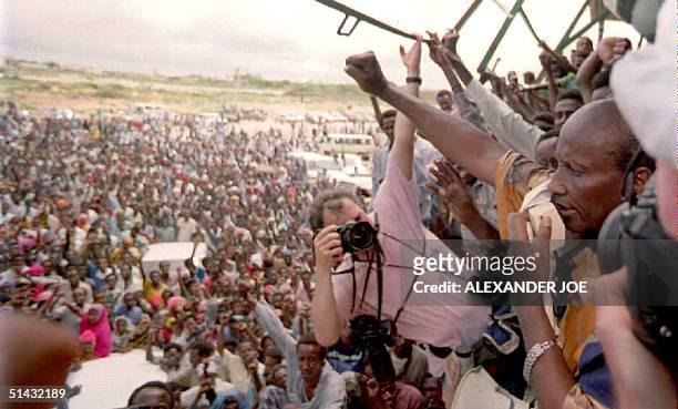 Somali warlord Mohamed Farrah Aidid addresses a crowd of more than 1,000 supporters during a rally to protest the U.N. Military strikes against...