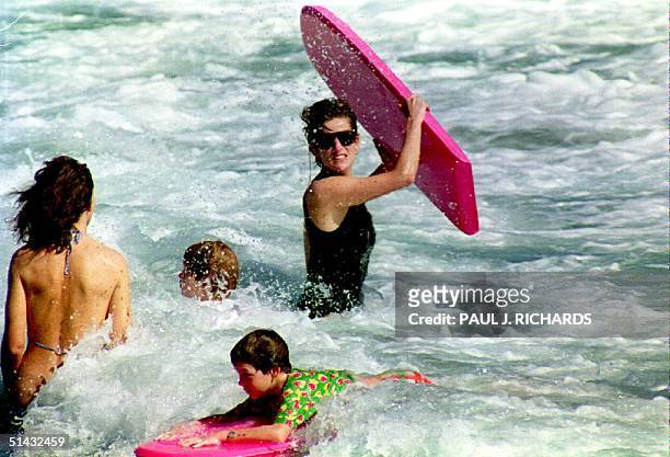 The Princess of Wales heads out into the surf as her son and Harry enjoys the waters of Indian Castle Beach 01 Jan 1993 with Lady Catherine Soames...