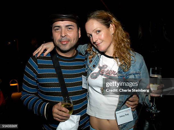 Designer Louis Verdad and designer Ashley Paige pose at the Mercedes Benz Fashion Week Cocktail Party at the St. Regis Hotel on October 5, 2004 in...