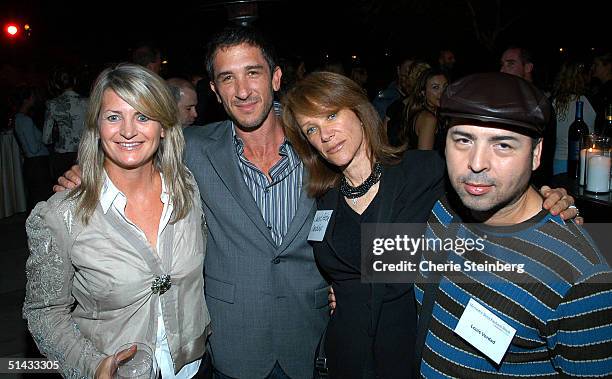 Marilyn Heston, Davis Factor, Janet Factor and designer Louis Verdad pose at the Mercedes Benz Fashion Week Cocktail Party at the St. Regis Hotel on...