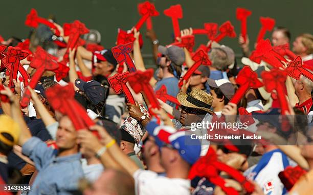 Fans of the Atlanta Braves do the Tomahawk Chop during their game against the Houston Astros in game one of the National League Divisional Series on...