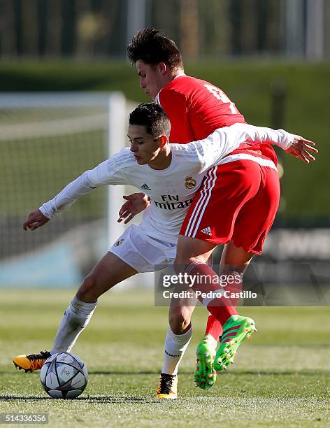 Gorka Fidalgo of Real Madrid CF duels for the ball with Oliver Sarkic of SL Benfica during the UEFA Youth League quarter-final match between Real...