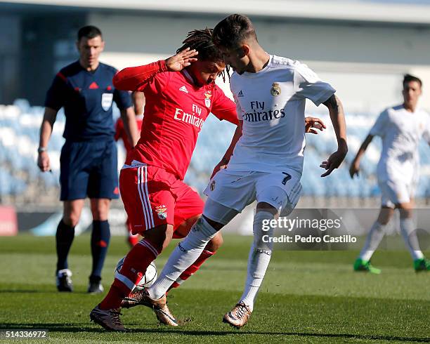 Cristian Cedres of Real Madrid CF duels for the ball with Hildeberto Pereira of SL Benfica during the UEFA Youth League quarter-final match between...