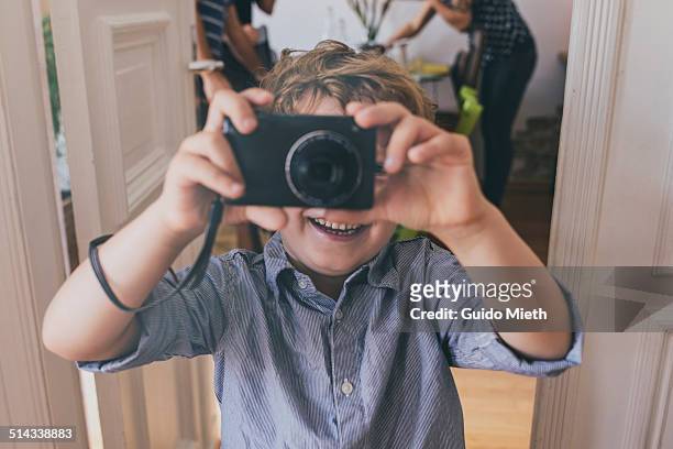 young boy taking pictures. - digital camera stock pictures, royalty-free photos & images