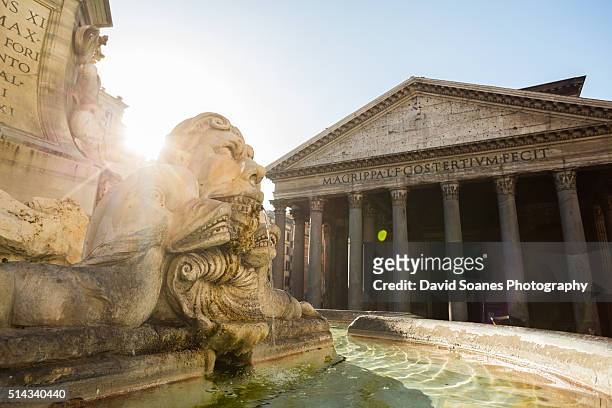 the fountain of the pantheon and pantheon in rome, italy - pantheon stock-fotos und bilder