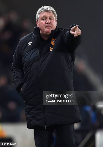 Hull City's English manager Steve Bruce gestures on the touchline during the English FA cup fifth round replay football match between Hull City and...