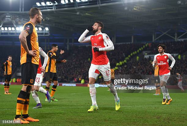 Olivier Giroud of Arsenal celebrates scoring the opening goal during the Emirates FA Cup Fifth Round Replay match between Hull City and Arsenal at KC...