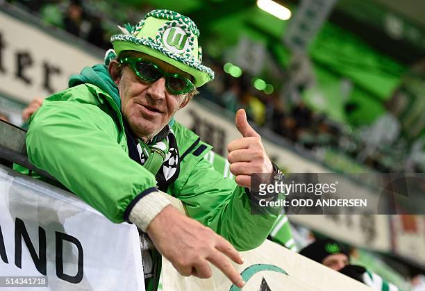 Wolfsburg's fan is pictured prior the second-leg round of 16 UEFA Champions league football match between VfL Wolfsburg and KAA Gent at the...
