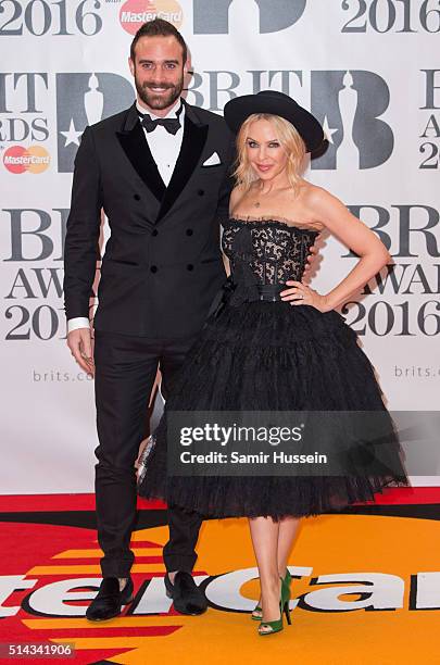 Joshua Sasse and Kylie Minogue attend the BRIT Awards 2016 at The O2 Arena on February 24, 2016 in London, England.