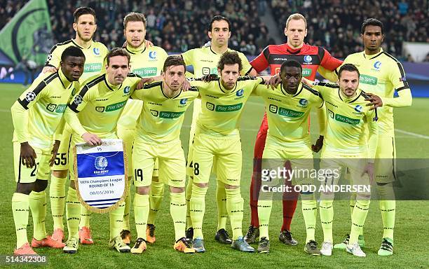 Gent's players pose prior to the second-leg round of 16 UEFA Champions league football match between VfL Wolfsburg and KAA Gent at the Volkswagen...