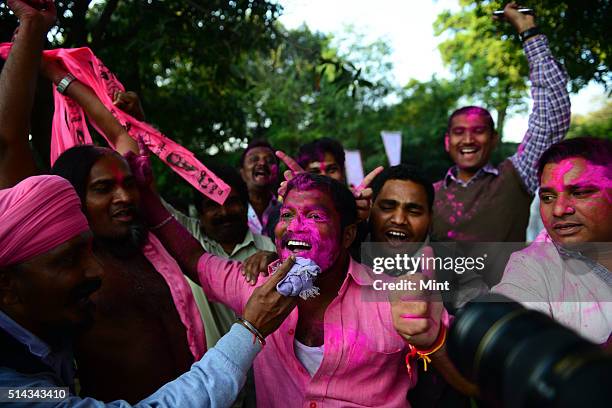 Telangana Rashtra Samiti supporters celebrating after Telangana Bill passed in Lok Sabha on February 18, 2014 in New Delhi, India.