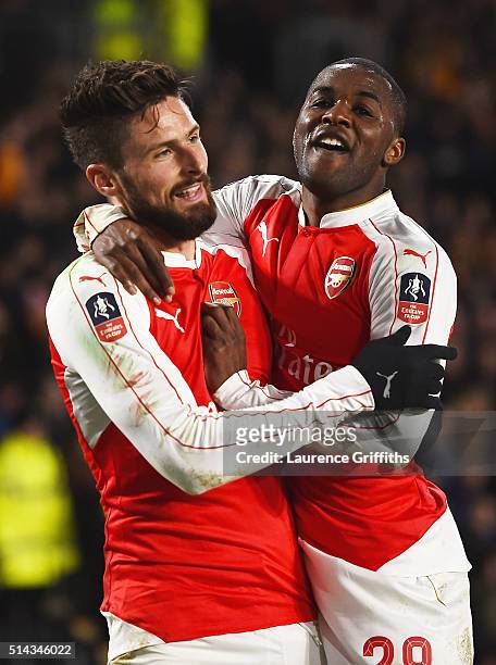 Olivier Giroud of Arsenal celebrates scoring the second Arsenal goal with Joel Campbell during the Emirates FA Cup Fifth Round Replay match between...