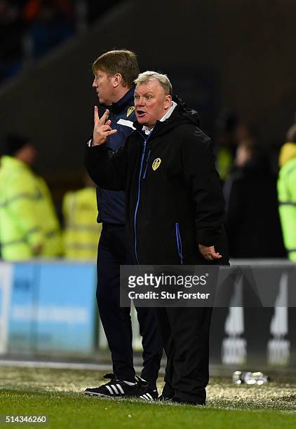 Leeds manager Steve Evans and his assistant Paul Raynor react during the Sky Bet Championship match between Cardiff City and Leeds United at Cardiff...