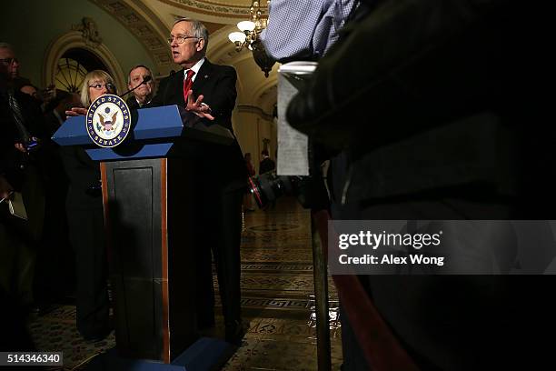 Senate Minority Leader Sen. Harry Reid speaks as Sen. Patty Murray and Senate Minority Whip Sen. Richard Durbin listen during a news briefing after...