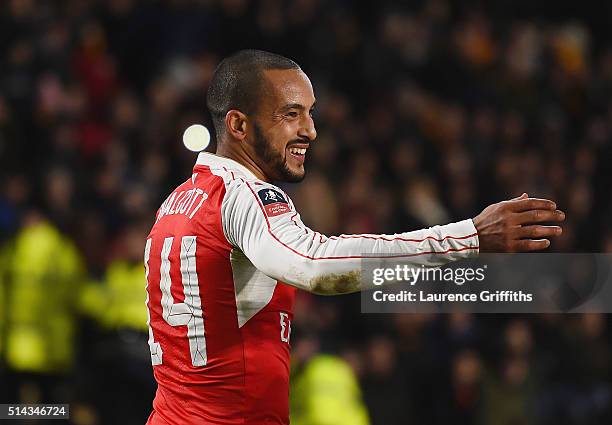 Theo Walcott of Arsenal celebrates scoring his team's fourth goal during the Emirates FA Cup Fifth Round Replay match between Hull City and Arsenal...