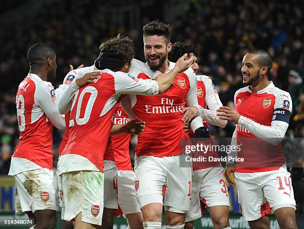 Olivier Giroud celebrates scoring a goal for Arsenal with Mathieu Flamini and Theo Walcott during the match between Hull City and Arsenal in the FA...