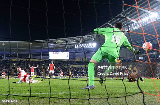 Olivier Giroud scores Arsenal's 2nd goal past Eldin Jakupovic of Hull during the match between Hull City and Arsenal in the FA Cup 5th round at KC...