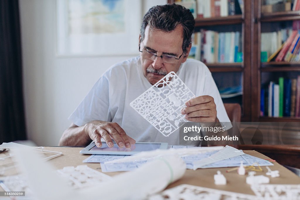 Senior Man using tablet pc.