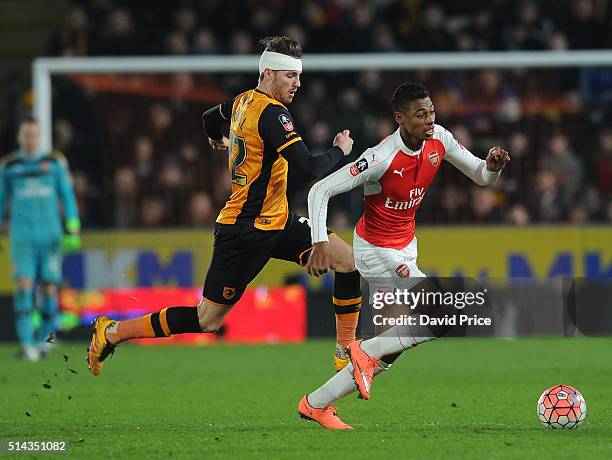 Jeff Reine-Adelaide of Arsenal takes on Nick Powell of Hull during the match between Hull City and Arsenal in the FA Cup 5th round at KC Stadium on...