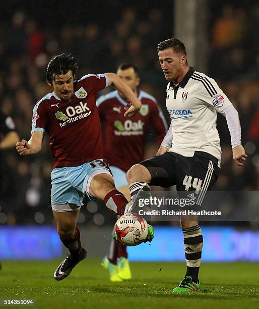 Joey Barton of Burnley tackles Ross McCormack of Fulham during the Sky Bet Championship match between Fulham and Burnley at Craven Cottage on March...