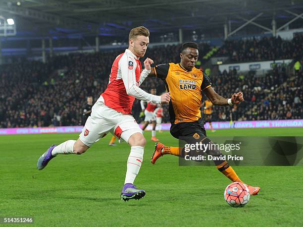 Calum Chambers of Arsenal takes on Moses Odubajo of Hull during the match between Hull City and Arsenal in the FA Cup 5th round at KC Stadium on...