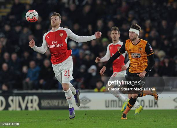 Calum Chambers of Arsenal breaks past Nick Powell of Hull during the Emirates FA Cup 5th Round replay between Hull City and Arsenal at the KC Stadium...