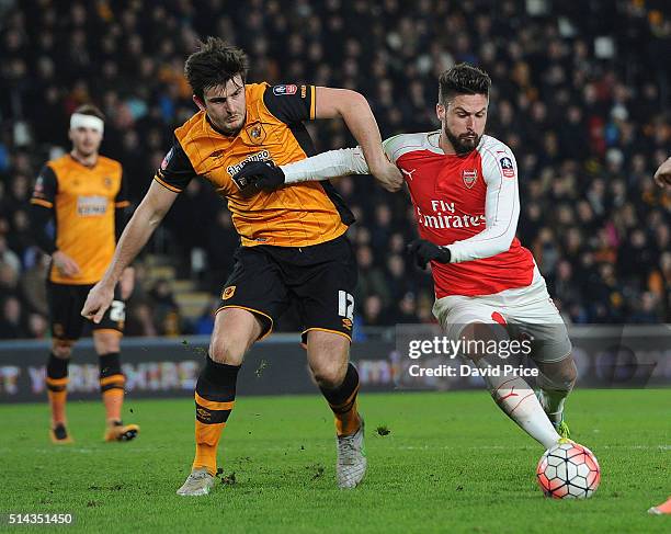 Olivier Giroud of Arsenal takes on Harry Maguire of Hull during the match between Hull City and Arsenal in the FA Cup 5th round at KC Stadium on...