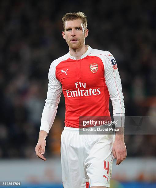 Per Mertesacker of Arsenal leaves the pitch with a head injury during the match between Hull City and Arsenal in the FA Cup 5th round at KC Stadium...