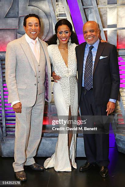 Smokey Robinson, cast member Lucy St Louis and Berry Gordy pose backstage following the press night performance of "Motown The Musical" at The...