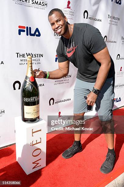 Player Jason Collins celebrates with Moet & Chandon at the 12th annual Desert Smash at the Westin Mission Hills Golf Resort and Spa on March 8, 2016...