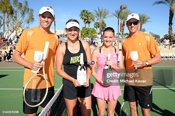 Tennis players Bob Bryan, Victoria Azarenka, Agnieszka Radwanska and Mike Bryan celebrate with Moet & Chandon at the 12th annual Desert Smash at the...