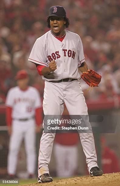 Pitcher Pedro Martinez of the Boston Red Sox celebrates after striking out Chone Figgins of the Anaheim Angels to end the seventh inning of the...