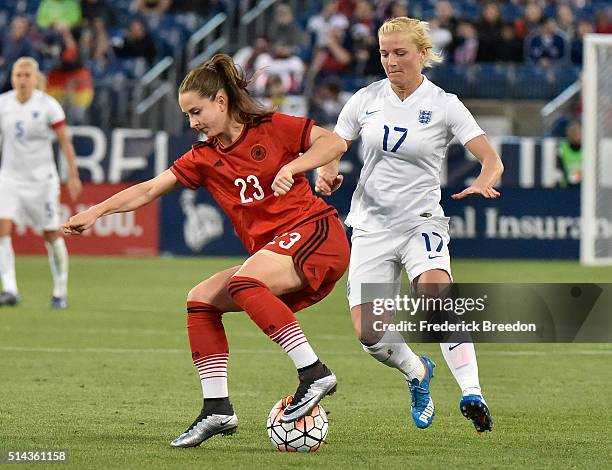 Sara Dabritz of Germany plays against Katie Chapman of England in a friendly international match in the Shebelieves Cup at Nissan Stadium on March 6,...