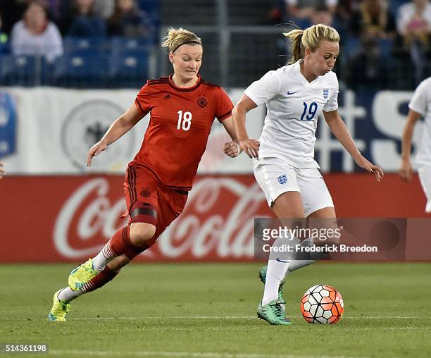 Toni Duggan of England plays against Alexandra Popp of Germany in a friendly international match in the Shebelieves Cup at Nissan Stadium on March 6,...